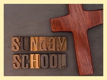 wooden cross and the words Sunday School